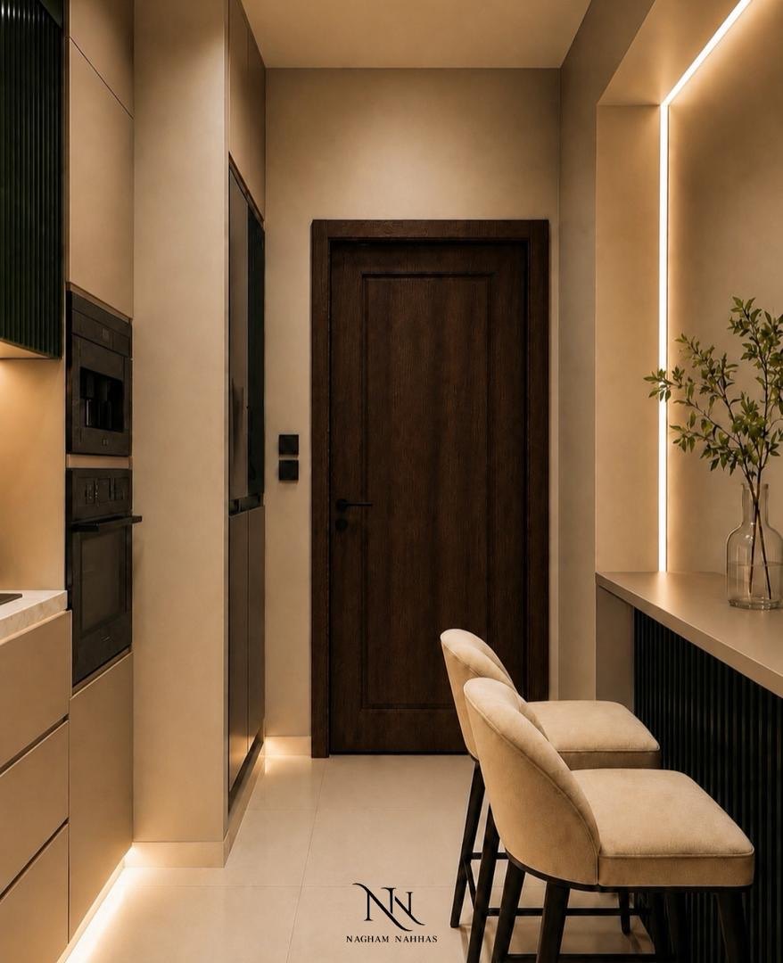 Kitchen corridor with a walnut door and a lit stone niche holding a glass vase